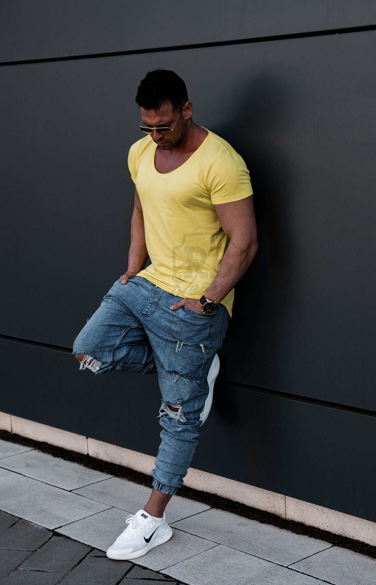 Side view showing men wearing athletic fit yellow scoop neck t-shirt