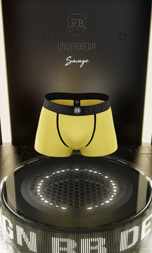 Yellow underwear with black waistband on a reflective surface, branded 'RB Underwear'.